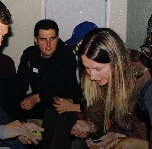 Square Pegs members sharing a laugh during a group activity